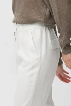 Lniane spodnie off white z wąską nogawką